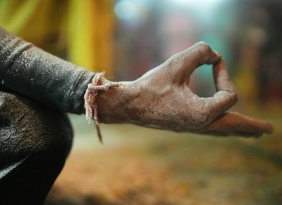 Close-up of a person's hands in a yoga mudra.