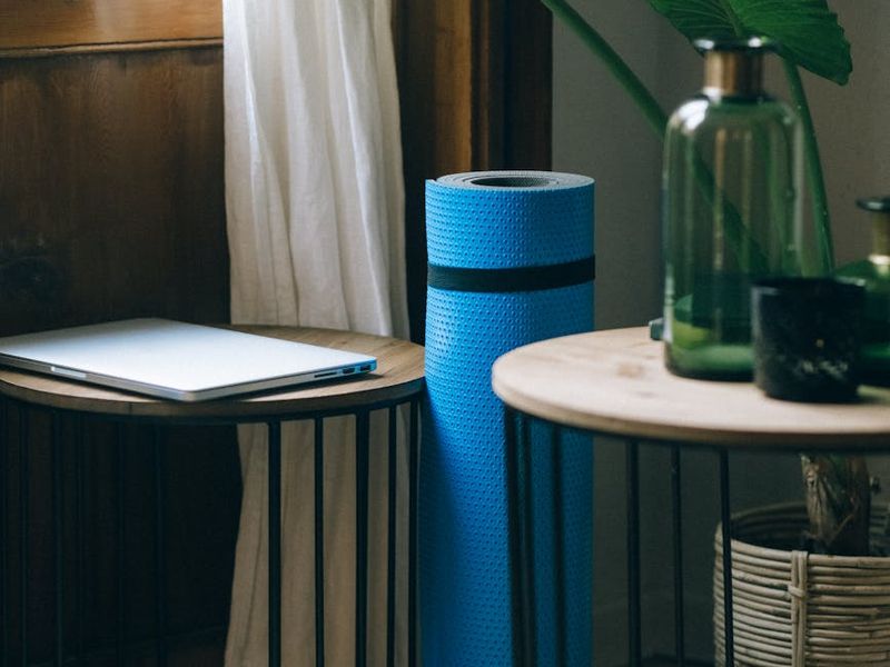 Spacious, clean room with a yoga mat on the floor.